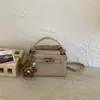 Bolso de Mano Cuadrado Pequeño Casual Simple Estilo Coreano para Mujer 2026 Nuevo Modelo de Primavera Bolso de Hombro Cruzado de Alta Calidad Elegante