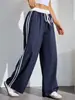 Atacado de calças casuais femininas estampadas da moda estilo americano, de cintura alta, para primavera e outono, com color blocking esportivo e design de perna reta