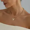 Accesorios transfronterizos europeos y americanos: Collar de corazón con textura de cadena minimalista vintage, collar de borlas versátil de nicho moderno para mujer