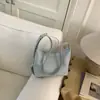 Bolso de moda coreana elegante para mujer con estampado de lichi, bolso tipo dumpling, nuevo bolso de hombro y cruzado simple de verano 2026 para el día a día