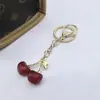 Llavero de Cereza de Moda Retro Europeo y Americano Más Vendido Transfronterizo con un Toque de Alta Gama, Accesorio Colgante de Fruta de Cereza para Bolsa