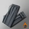Nuevo modelo de invierno para hombre, pantalones casuales rectos de nailon-spandex con forro polar y cintura elástica con cordón para papás