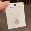 Moda de Nicho Simple Chapado en Diamante Cuadros Flor de Cuatro Hojas Collar Personalidad Femenina Lujo Ligero Versátil Cadena de Clavícula de Gama Alta Venta al por Mayor