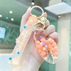 Llavero de cangrejo de pinza con arena movediza y aceite, lindo colgante de frijol de caramelo flotante para llave de coche, accesorio para mochila de estudiante