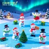 Decorações de Natal em miniatura: uma pequena figura de boneco de neve segurando uma placa, perfeita para criar uma charmosa paisagem de inverno, decorações DIY e pequenos enfeites