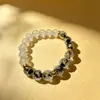 Pulsera de Explosión de Lámina de Oro Negro con Esmalte Blanco Nuevo Estilo Chino Tallado de Media Cara Lujo Ligero Simple Hombres Mujeres Pulsera Cultural de Juego