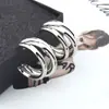 WISH El Más Vendido de AliExpress: Aretes Metálicos Irregulares de Media Luna, Modernos y Versátiles en Colores Dorado y Plateado