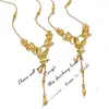 Tienda de Oro Mismo Estilo Floreciente de Gama Alta Collar de Mariposa Floral Moda Lujo Ligero Juego de Joyas de Oro Arena Accesorio de Collar de Cadena