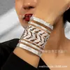 Moda Punk Europeo y Americano Mano Abierta Decorada Pulsera Ancha Hueca de Metal Pulsera Exagerada de Metal Anillo para el Brazo