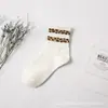 Calcetines de tubo medio para mujer estampado clásico de leopardo calcetines altos para niños otoño e invierno vintage versátiles estilo coreano calcetines para mujer cálidos transpirables