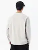 Camiseta de manga larga con cuello redondo para hombre, nuevo estilo primavera/otoño 2026, diseño retro japonés de moda, color liso, diseño estructurado con detalles de patchwork