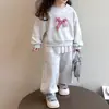 Conjunto de Niña para Primavera y Otoño Bebé Elegante Infantil Moderno Versión Coreana Sudadera con Adorno de Encaje y Lazo y Pantalones de Chándal