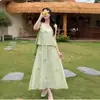 Chal sin mangas con lazo tridimensional de la primavera de 2026 Vestido falso de dos piezas