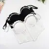 Camisola plisada con cuentas de pedrería y copas, diseñada para llevar como prenda exterior, con un diseño irregular de punta y estilo corsé de ballenas, pura y seductora