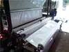 Máquina automática de espalhamento de filme plástico