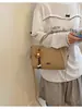 Bolso de hombro individual con textura tejida para mujer 2026 nuevo estilo versión coreana bolso de mano de moda gran capacidad para ir al trabajo simple versátil bolso cruzado