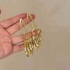 Pendientes largos de trigo con borlas doradas 2024, pendientes de lujo ligeros y de alta gama para mujer, pendientes únicos y exagerados con un toque atmosférico.