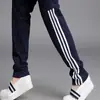 Lote direto da fábrica de calças casuais para todas as estações cintura com três listras calças esportivas Leggings justas curinga feminino uma geração de cabelo