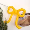 Nuevas decoraciones de globos con forma de lazo de corazón para crear un ambiente sofisticado de estilo coreano en cafeterías y pastelerías, perfectas para celebraciones de cumpleaños