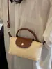 Bolso de Moda de Lujo tipo Bollo de Paja para Mujer 2026 Nuevo Estilo Bolso de Playa Vacaciones Bolso Pequeño Cruzado Tejido a Mano de Nicho