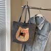 Mochila Biscuit Cat para mujer, otoño 2024, nueva bolsa de mano de estilo universitario de moda, bolso de hombro de gran capacidad de Corea del Sur.