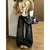 ChaoLi tiene en stock jeans negros y grises con estampado de estrellas y dobladillo curvo para mujer, pantalones rectos de pierna ancha con diseño adelgazante de cintura alta para primavera y otoño