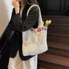 Bolsa tejida casual de moda de verano 2025 Nueva llegada Bordada Vacaciones en la costa Bolsa de algodón y lino Bolso de hombro moderno para mujer