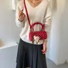 Bolso cilíndrico de moda nuevo 2026 estilo coreano transfronterizo con estampado de lunares único y moderno, versátil para llevar en la mano, al hombro y cruzado