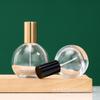 Botella de perfume redonda con forma de bayoneta, 30 ml y 50 ml, con pulverizador de vidrio, para agua cosmética, venta al por mayor