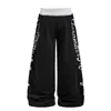 Pantalones casuales de retazos con estampado de letras desgastado estilo retro americano, unisex streetwear holgados de pierna ancha con pierna curva