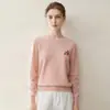 Suéter de punto cálido de cachemira popular de alta gama con cuello redondo bordado 100% cachemira pura, elegante, cómodo, de corte holgado
