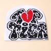Gorro frío de calle de personalidad jacquard de EE. UU. unisex gorro de punto jacquard gorro a prueba de viento venta al por mayor de fábrica