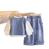 Otoño 2026 Nuevo Bolso Cruzado para Niñas de Comercio Exterior Chaleco de Mezclilla Versátil Elegante Moda para Bebés Conjunto de Tres Piezas de Manga Larga Moderno