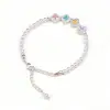 Pulsera de perlas de trébol de cuatro hojas de colores francesa nicho lujo ligero circón de colores ajustable joyería de mano accesorio de moda versátil para mujer