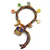 Pulseira do deus da riqueza de cinco vias estilo Xizang oito santos padroeiros cinco mestres Manjushri deus da riqueza amarelo thangka corda tecida à mão pulseira do ano desta vida