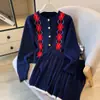 Conjunto de Dos Piezas Otoño 2026 Nuevo Estilo Universitario Vintage Patrón de Diamantes Chaqueta Cardigan de Punto de Manga Larga y Falda Corta Plisada