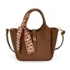 Bolsa de Balde Texturizada de Alta Qualidade Portátil Feminina 2026 Novo Estilo Moda Retrô Bolsa de Ombro Simples Versátil para o Dia a Dia Bolsa Transversal