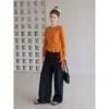 Top blanco estilo coreano con dobladillo irregular y empalme de cinta para mujer, nueva camiseta de manga larga ajustada para otoño, adecuada como capa base