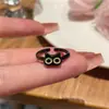 Anillo de gato negro simple y divertido 2023 diseño de nicho femenino anillo para dedo con boca de monstruo pequeño lindo venta al por mayor