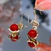 Pendientes colgantes de cuentas rojas con bolsa de Año Nuevo 2024, estilo chino, elegantes pendientes de moda para otoño e invierno.