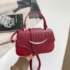 Bolso de diseño de nicho de alta gama para mujer 2026 Otoño Nuevo Bolso de mano Retro Popular Bolso de hombro Cruzado de sillín