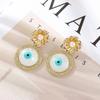 Pendientes de ojo de diablo creativos europeos y americanos para mujer, pendientes de gota de aceite de resina de alta gama que combinan con todo, pendientes de diseño de nicho de moda.