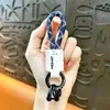 Colgante de Llavero de Cuero Trenzado de Gama Alta, Cuero Genuino con Logo Personalizable, Correa de Alta Calidad, Llavero de Coche Antiperdida