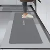 Las alfombrillas de suelo para cocina de lodo de diatomeas son antideslizantes, impermeables, resistentes al aceite y a la suciedad, alfombrillas de puerta lavables a mano y sin necesidad de lavado para el hogar.