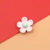 Flor de cinco pétalos accesorios de resina flores pequeñas frescas diy hecho a mano pegamento de crema parche para funda de teléfono accesorios para el cabello al por mayor