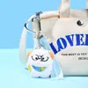 Taobao Xiaohongshu Popular Peluche Auriculares Conejo Muñeco Llavero Corazón Presionar Sonido Muñeco Regalo Mayoreo