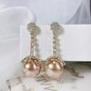 Aretes vintage de nicho con diamantes y perlas champán, aretes de temperamento con alto sentido de la personalidad, nuevos aretes al por mayor 2024