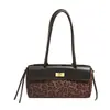 Bolso de mano de moda con estampado de leopardo para mujer, nuevo bolso de verano 2026 estilo Kelly, bolso pequeño único para hombro y cruzado