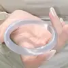 Venta al por mayor de fábrica suministro en vivo pulsera ojo de gato luz de luna blanca pulsera de moda para mujer tiembla comercio electrónico una generación de cabello