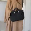 Bolsa de ombro estilosa e prática para o dia a dia, com um design único, coleção outono coreana de 2026, estilo minimalista, grande capacidade, novo modelo feminino